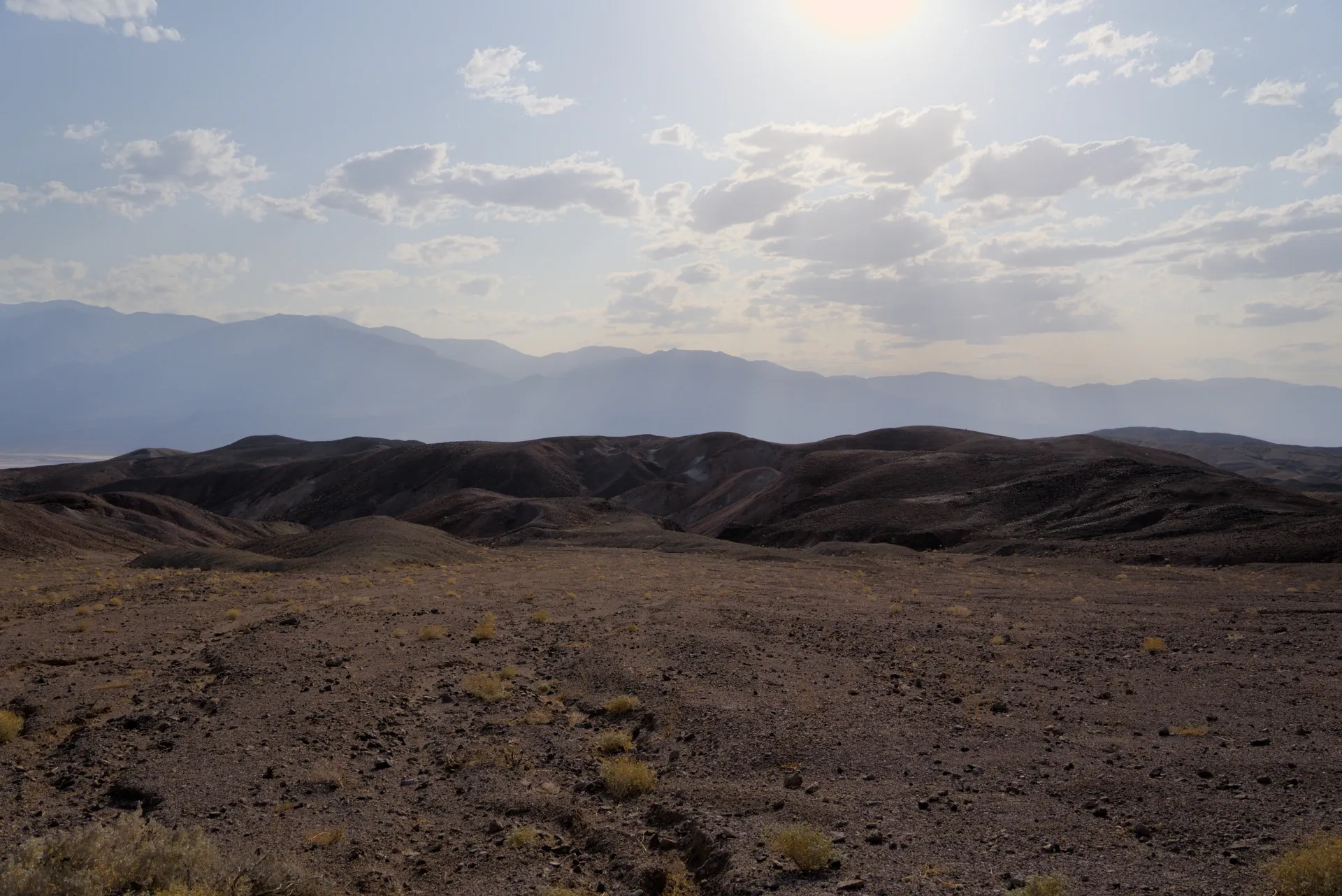 The sun over the badlands hills.