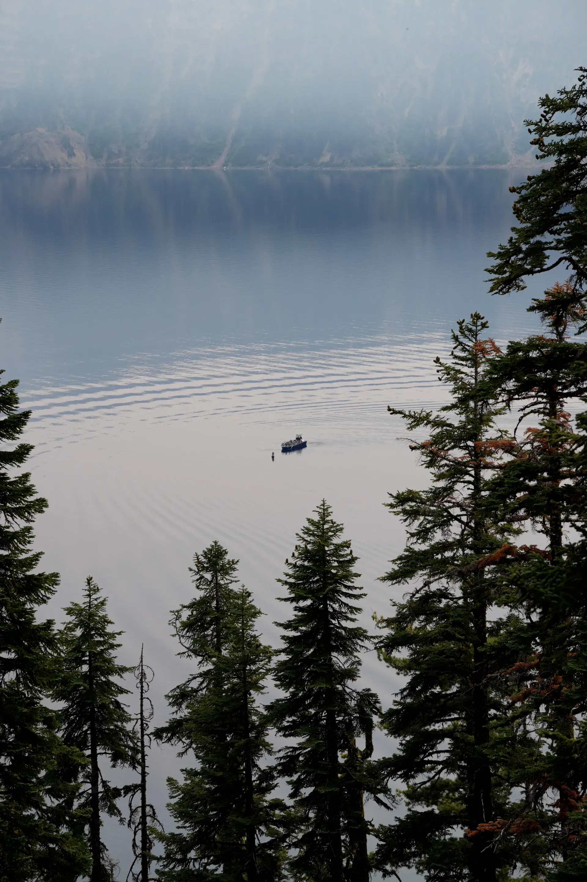A single boat on Crater Lake.