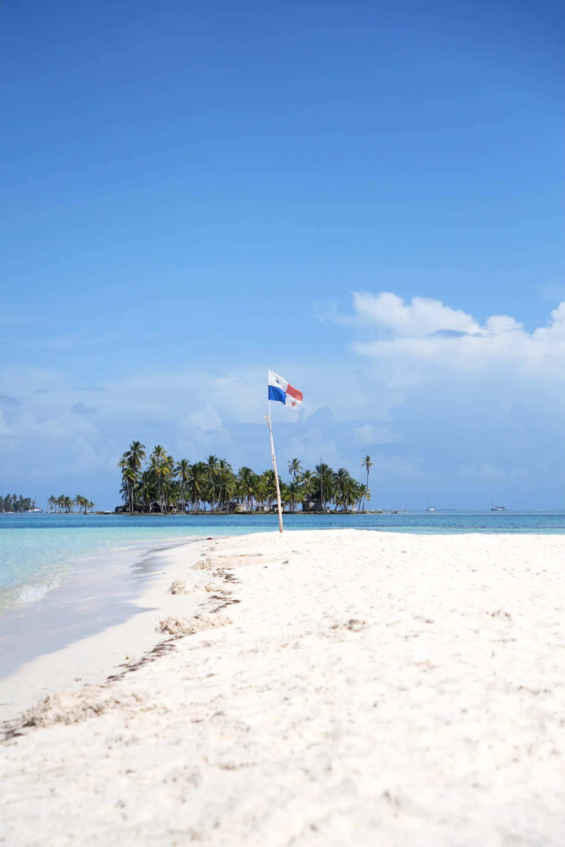A flag on a sandbar in San Blas.