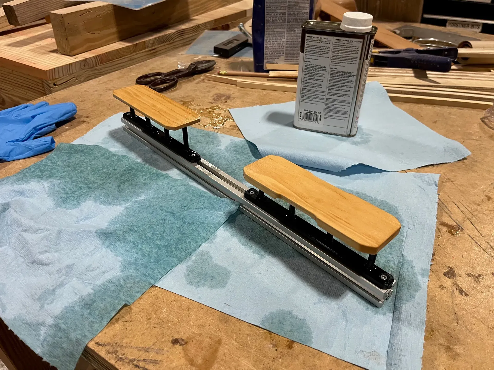 Parts for a wooden pencil case being finished with Danish oil