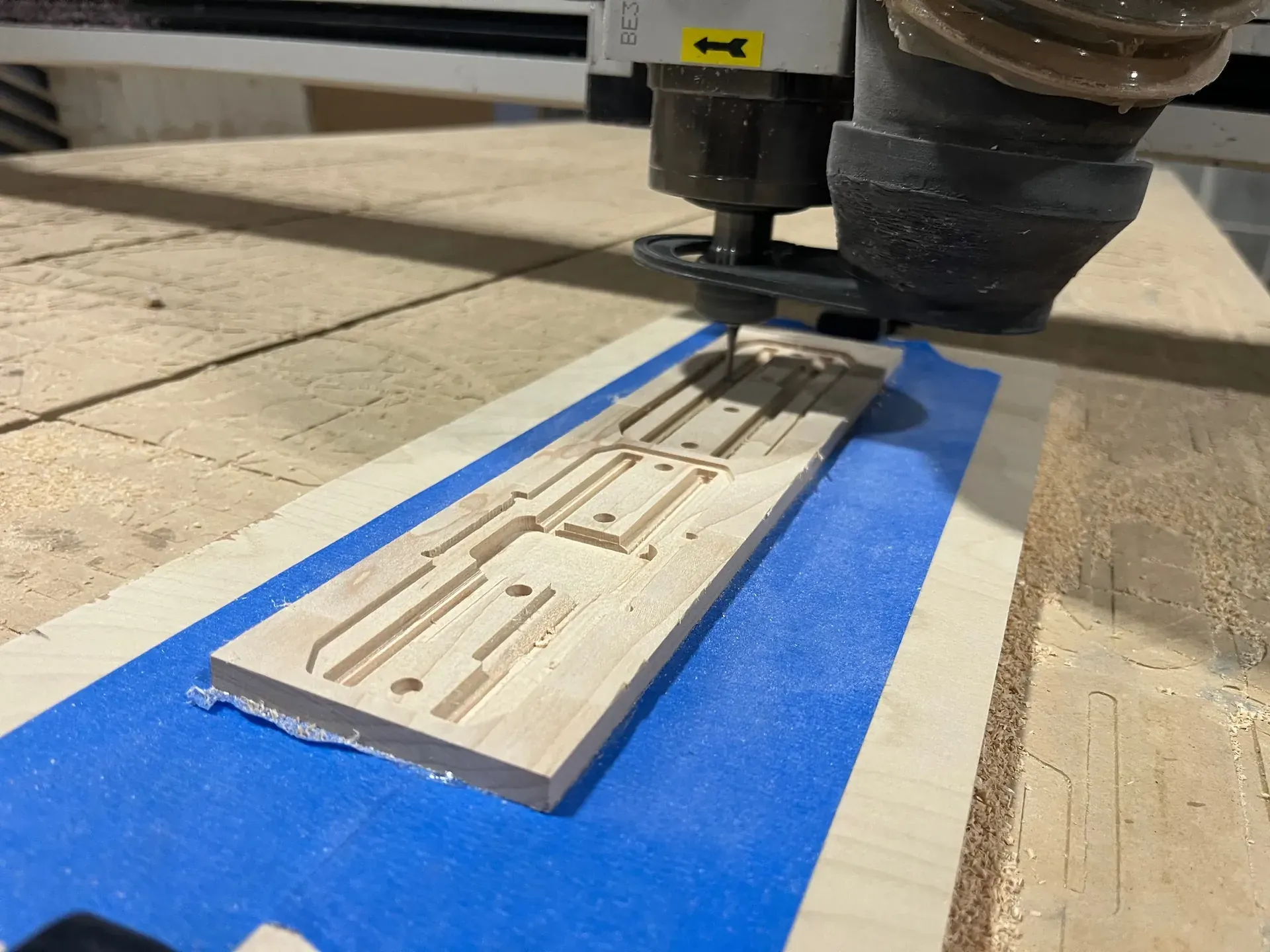 a CNC machine milling wood