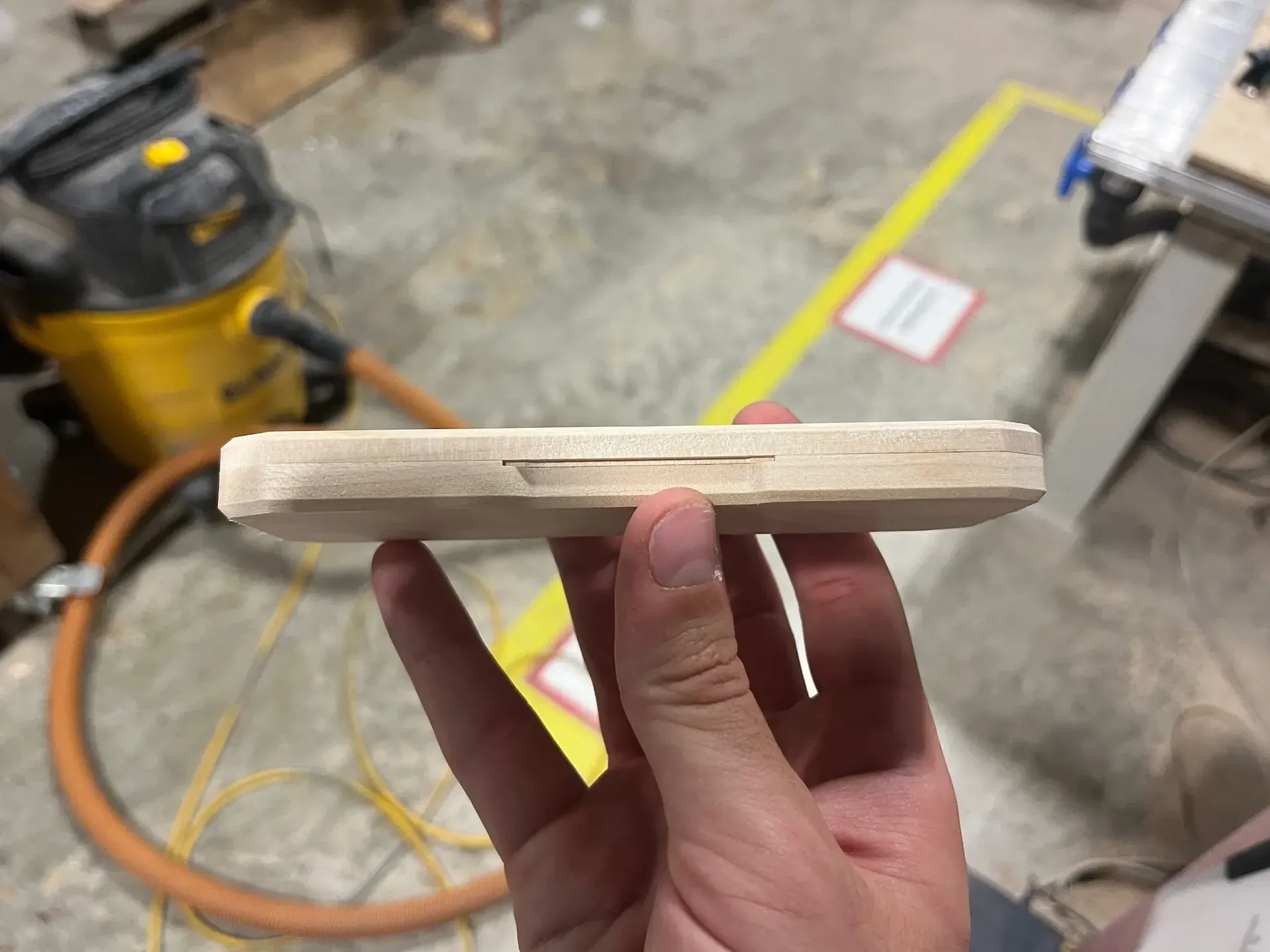 Side of a milled wooden pencil case.